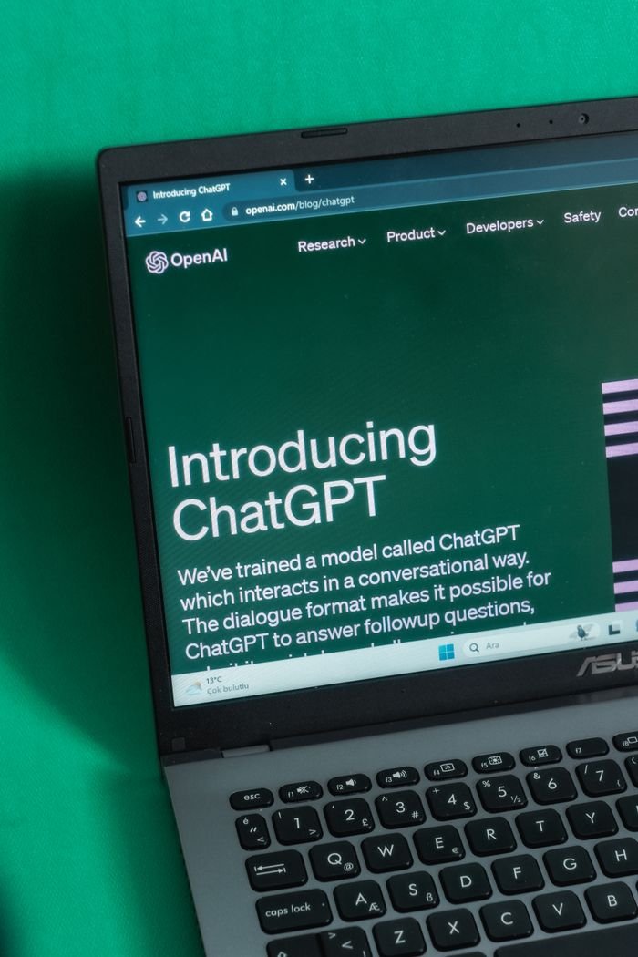 The Art of Drawing Readers In: Your attractive post title goes here Laptop screen displaying the introductory page of ChatGPT on OpenAI's website.